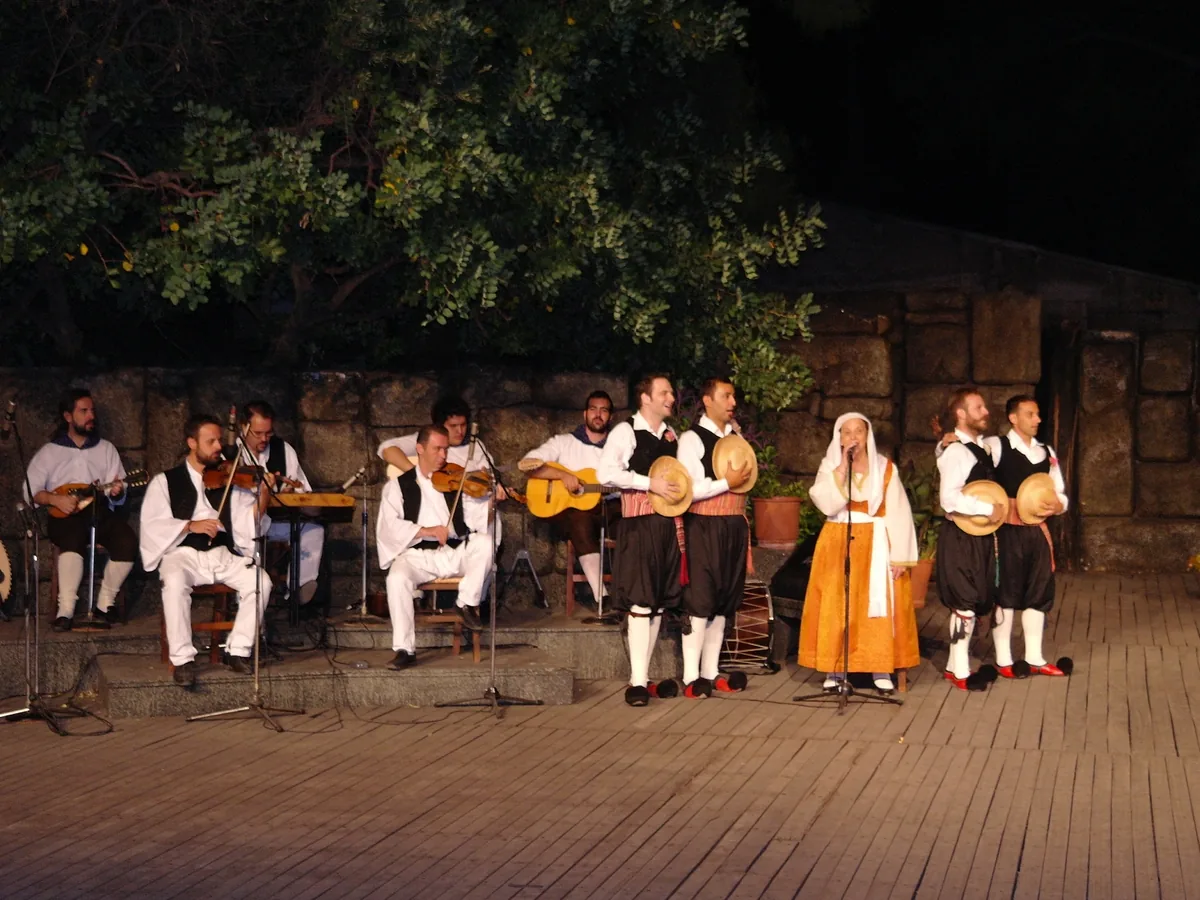 Musicians and singers in traditional costume on the open-air stage of the Dora Stratou theatre, Athens